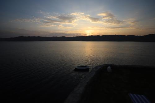 a boat in the middle of a large body of water at Noprea Boutique Hotel in Aswan