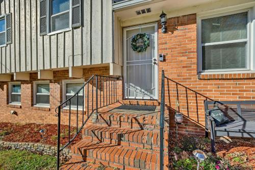 a front door of a brick house with a wreath on it at Modern Birmingham Escape with Yard and Fire Pit! in Birmingham