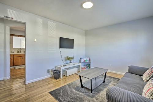 a living room with a couch and a table at Middletown Township Home, Close to Beaches! in Leonardo