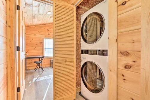 a tiny house with four washer and dryers in a room at Laurelville Cabin Less Than 11 Mi to Old Mans Cave! in Laurelville