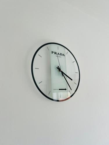 a clock on a wall with the word parada on it at Penthouse with awesome terrace and free parking in Kortrijk