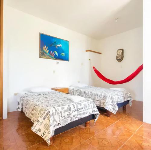 Cama o camas de una habitación en Galapagos Verde Azul