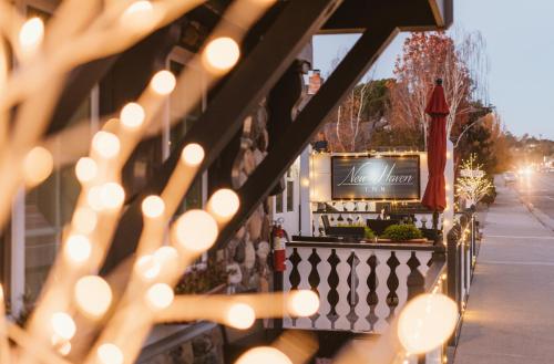 a string of lights on a fence with a television at New Haven Inn in Solvang