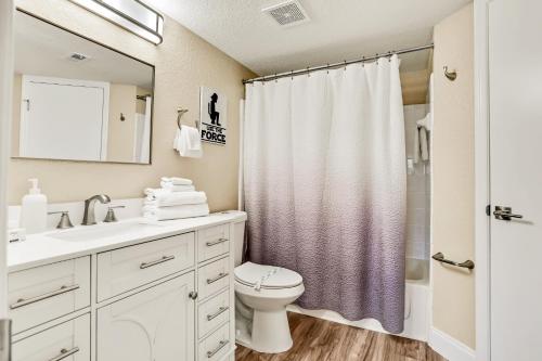 a bathroom with a sink and a toilet and a shower at Villa del Sol #324 in Kissimmee
