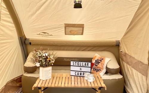 a table in a tent with a sign on it at Stellar GoldenHill Cameron in Tanah Rata