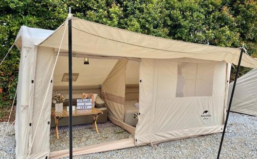 a beige tent with a bed in it at Stellar GoldenHill Cameron in Tanah Rata