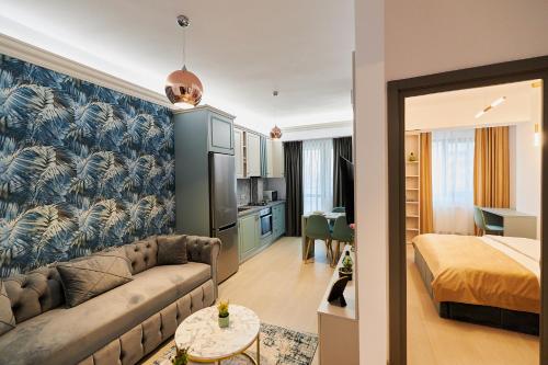 Ένα ή περισσότερα κρεβάτια σε δωμάτιο στο UpTown Apartments