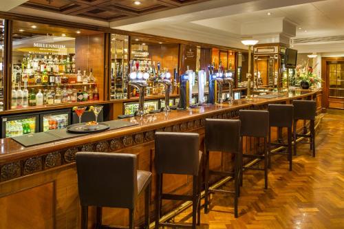 a large bar with a large counter top at Copthorne Tara Hotel London Kensington in London