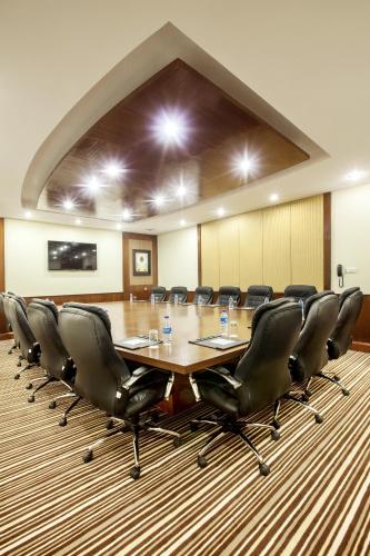 a conference room with a long table and chairs at The Grand Dragon Ladakh in Leh
