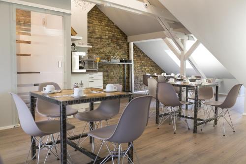 a dining room with a long table and chairs at Hotel Forty Four in Frankfurt/Main