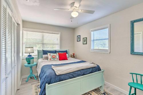 a bedroom with a bed and a ceiling fan at Walk to Cedar Creek Reservoir Home with Fire Pit! in Tool