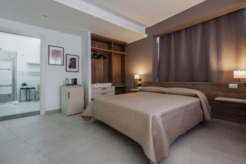Кровать или кровати в номере Archimede's Rooms