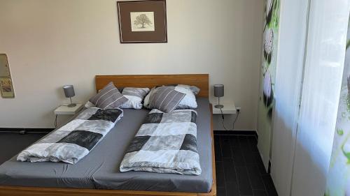 two twin beds in a bedroom with two tables at Ferienhaus Willmann in Böhme
