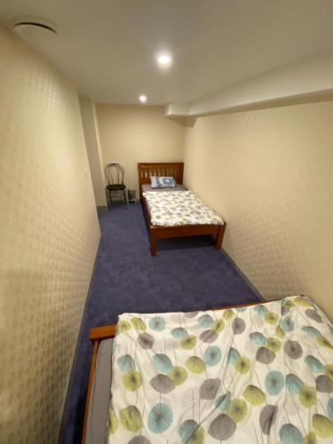 a small bedroom with a bed and a table at Liivalaia 40 cozy kitchen studio in Tallinn