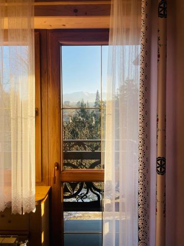 a window with a view of a mountain view at U Maćka in Poronin