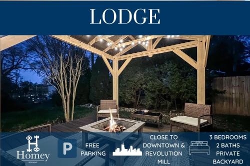 a pavilion with two chairs and a fire pit at Homey Lodge - Cozy home / Walk to Revolution Mill / Near Downtown / Perfect for groups and family / Free parking in Greensboro