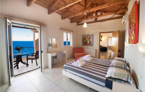 a bedroom with a bed and a view of the ocean at Villa Sophia in Évyiros