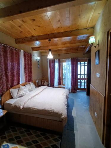 Ishan Log Huts-A boutique home stayにあるベッド