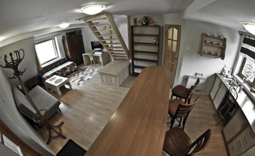 an aerial view of a living room with a table and chairs at Chata Apart in Zakopane