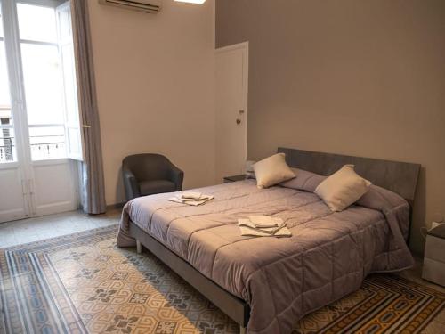 Кровать или кровати в номере Pacini Deluxe Apartment