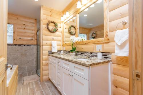 a bathroom with a sink and a shower at 7 Brand New Castle Rock Lake 4 Bedroom Lodge House in Friendship