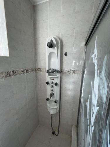 a bathroom with a shower with a toilet at 2 Bed Apartment at the Hideaway in St Mary