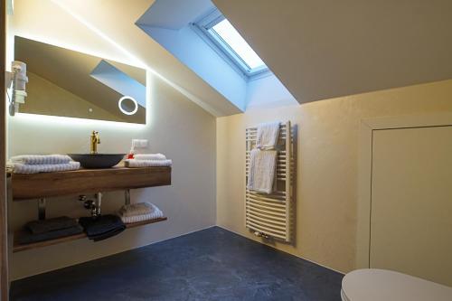 a bathroom with a sink and a skylight at Haus Michael Tritscher in Schladming