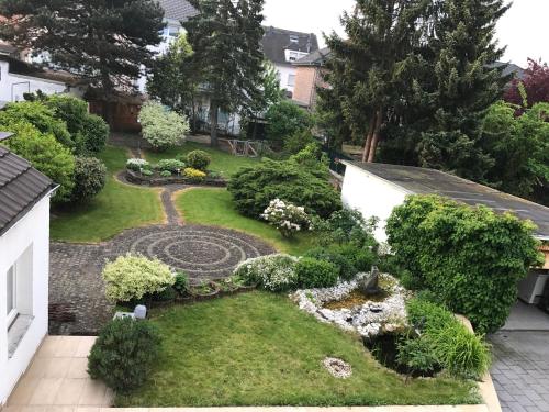 an aerial view of a backyard with a garden at Home Inn Hotel in Dormagen