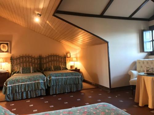 a bedroom with two beds in a room at Palacio de Cutre in La Goleta
