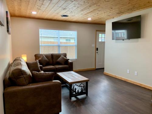 a living room with a couch and a table at High Valley Apartments in Pigeon Forge