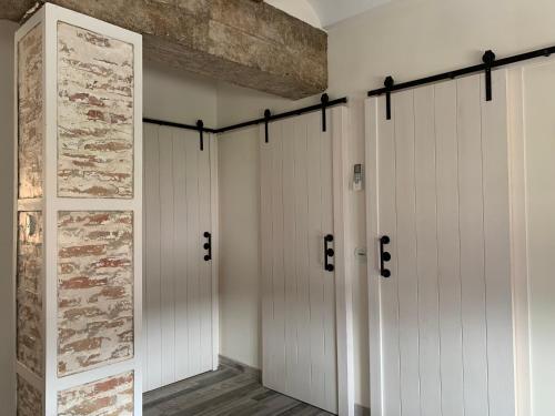 a row of white stalls in a room at Casa Chus in Albarracín