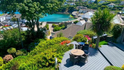 an aerial view of a house with a table and flowers at Portmellon Cove Guest House in Mevagissey