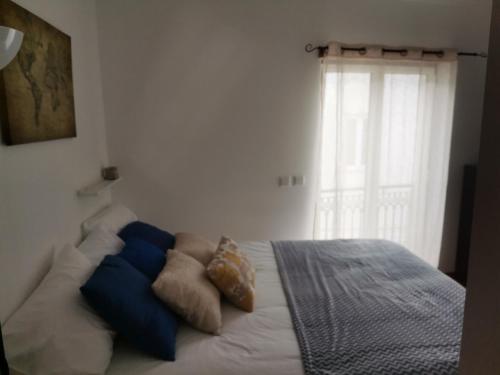 Ένα ή περισσότερα κρεβάτια σε δωμάτιο στο Studio acolhedor e confortável - Nazaré Waves