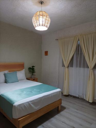 Een bed of bedden in een kamer bij Alojamiento el nixtamal