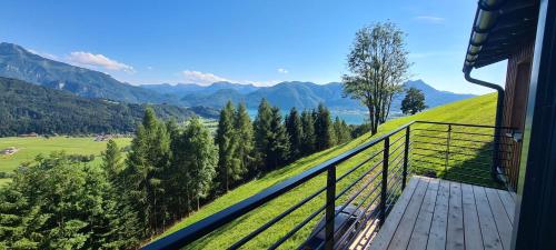 a balcony of a house with a view of a mountain at Ruhige Bergvilla in Alleinlage am Mondsee mit Seeblick Bergblick und Whirlpool in Innerschwand am Mondsee