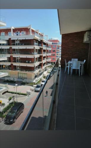 a view of a city with cars parked on a balcony at SummerhouseVelipoje-Te Kompleksi Fishta-Q1,36 in Velipojë