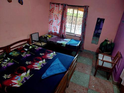 Ένα ή περισσότερα κρεβάτια σε δωμάτιο στο Honey Palace Homestay