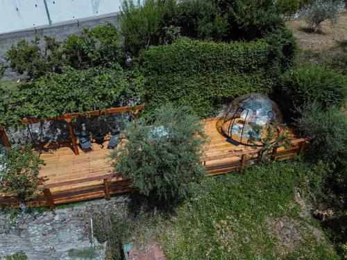 an overhead view of a wooden bench in a garden at @LaCasettasulFiume in Sarnico
