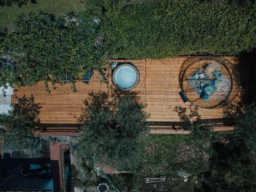 a wooden wall with a window and plants on it at @LaCasettasulFiume in Sarnico