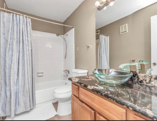 a bathroom with a sink and a toilet and a shower at Houston/Sugar Land Area 2 BDR- Bellaire in Houston
