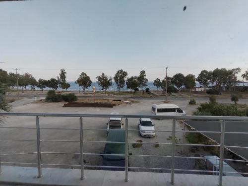 a parking lot with cars parked in a parking lot at Cemre Apart in Milas