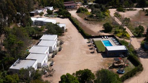 an aerial view of a house with a pool at cabañas laguna de zapallar maitencillo in Zapallar