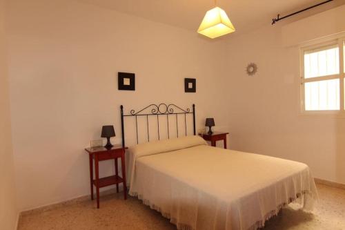 Posteľ alebo postele v izbe v ubytovaní Apartamento Paola