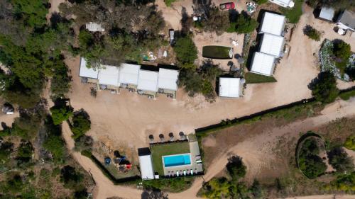 an aerial view of a yard with a pool at cabañas laguna de zapallar maitencillo in Zapallar