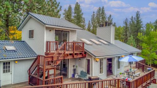 a home with a deck and a house at 068 - White Bear Lodge in Big Bear Lake