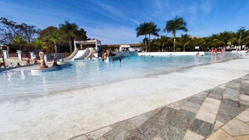 a large swimming pool with people in the water at Lacqua Diroma Parque - I - II -III - IV - V in Caldas Novas