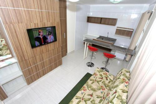 a living room with a couch and a piano at Lacqua Diroma Parque - I - II -III - IV - V in Caldas Novas