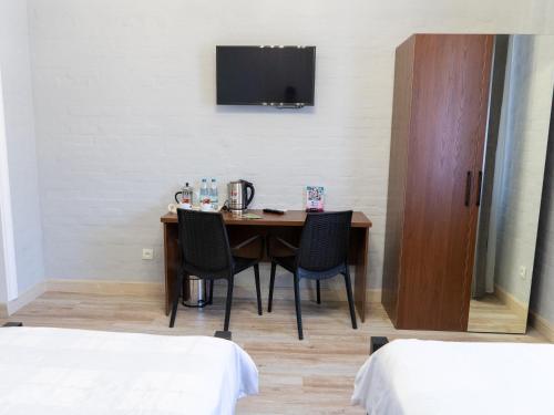 Una cama o camas en una habitación de NEST INN