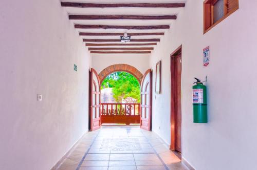 a hallway of a house with an archway at Casa de Campo Hotel & Spa in Villa de Leyva