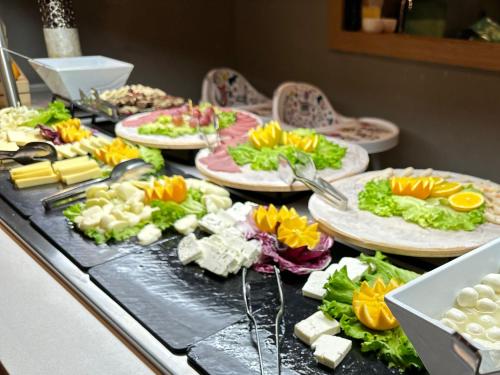 a buffet with plates of food on a table at Edition Old City Hotel in Istanbul